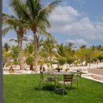 from the balcony looking on the garden with a table and 4 chairs at Laguna garden project Hawana Salalah Oman