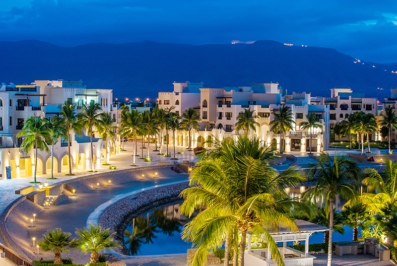 a photo for the marina bay with the mountains in the background at Hawana Salalah Oman