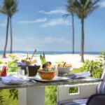 sitting area with a beach view at beach bar and restaurant in salalah rotana resort in hawana salalah