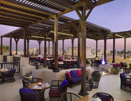 outdoor dining area at silk road restaurant in salalh rotana resort