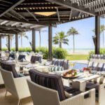 seating area with beach view at beach bar and restaurant in rotana salalah resort